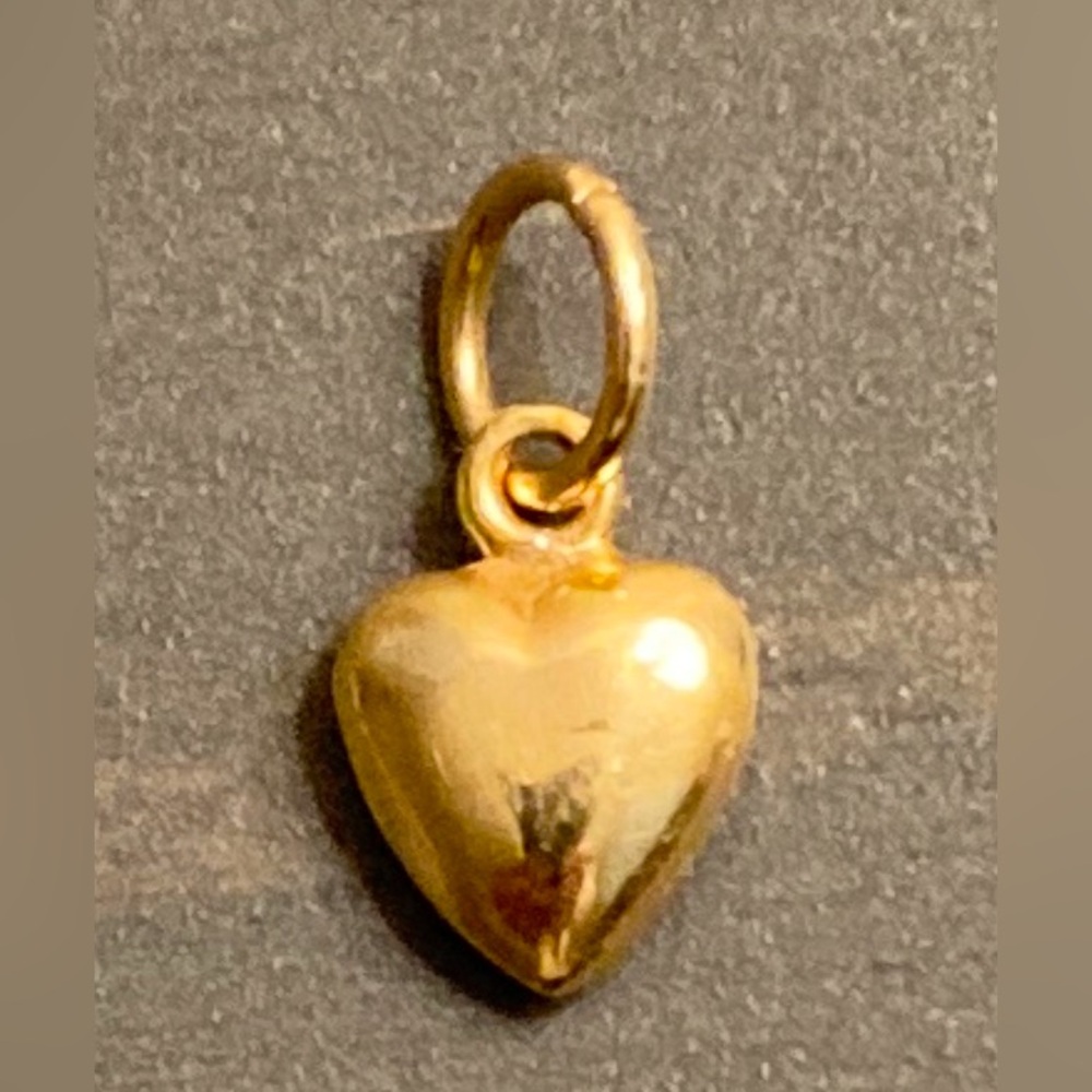 Beautiful little solid gold heart charm in 14k yellow gold.